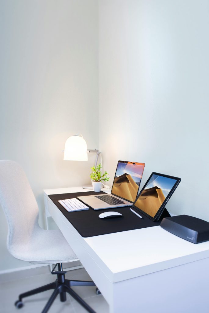 pexels-photo-2528118-2528118 Stylish home office desk with dual screens and minimalist decor. Perfect for remote work and productivity.